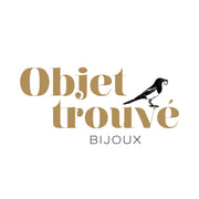 Logo de la marque objet trouvé bijoux noir et or avec la pie